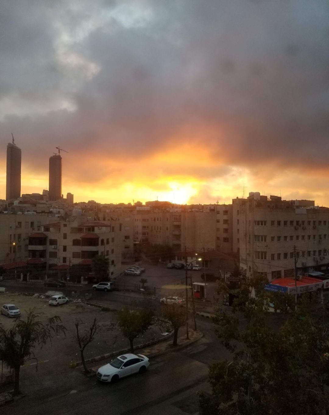 Sunrise over Amman, Jordan with golden sky and city skyline