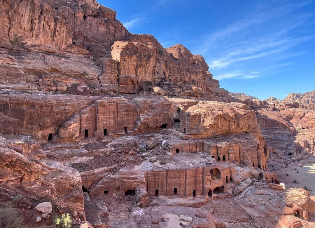 Ancient Nabataean tombs carved into the rose-red sandstone cliffs at Petra, Jordan