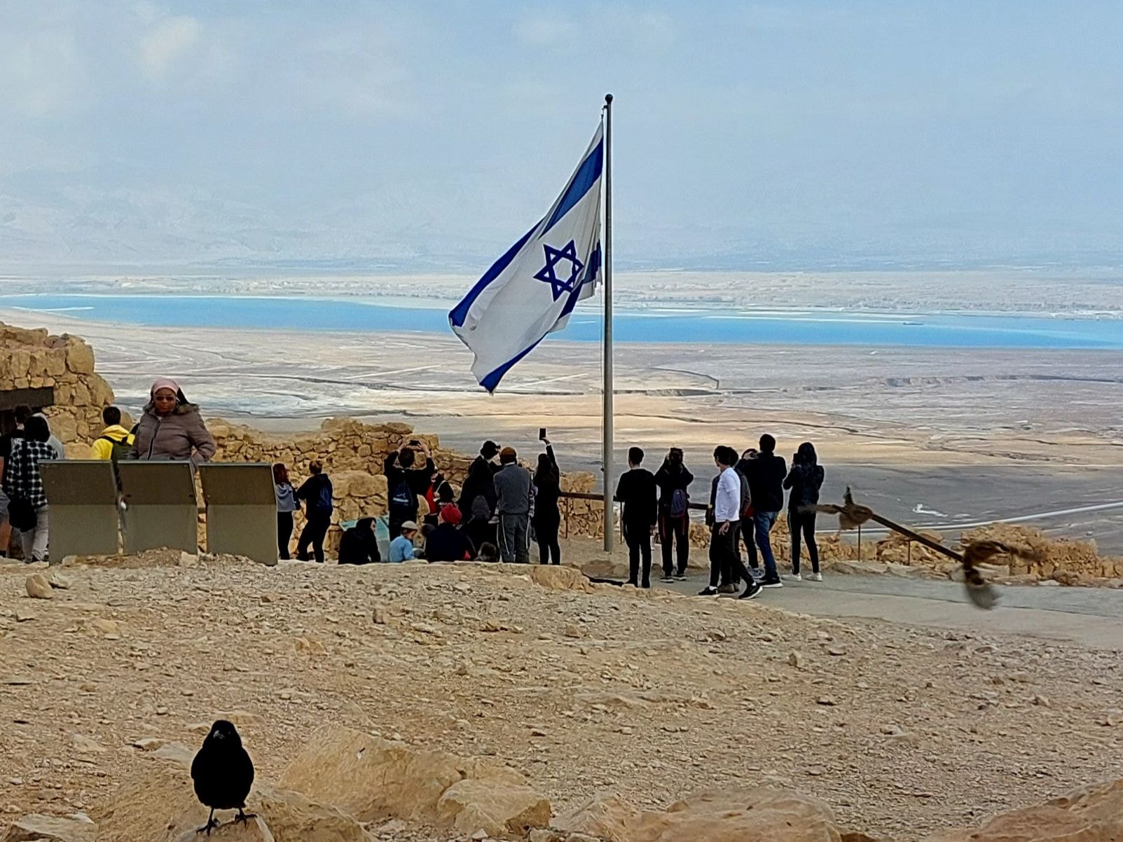 View from the top of Masada toward the Dead Sea with Israeli flag