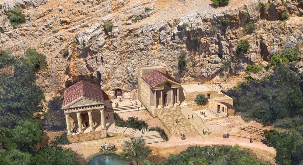 Aerial reconstruction model of the Roman temples at Caesarea Philippi showing two temple buildings nestled against a dramatic cliff face with figures walking the grounds